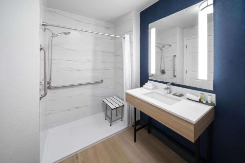 a bathroom with a sink and a shower at La Quinta by Wyndham San Antonio Northwest in San Antonio