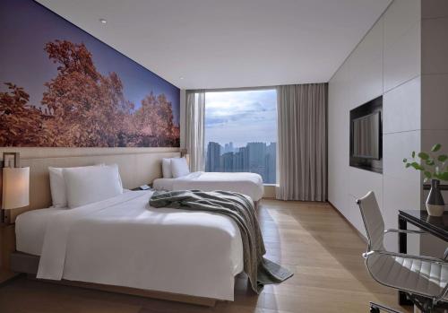 Кровать или кровати в номере EAST Beijing l 798 Art Zone l Shopping Mall l Airport l Subway