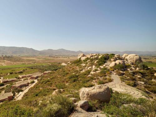 a view from the top of a hill with rocks at Banyan Tree Veya, Valle de Guadalupe - A Wellbeing & Wine Resort in Valle de Guadalupe