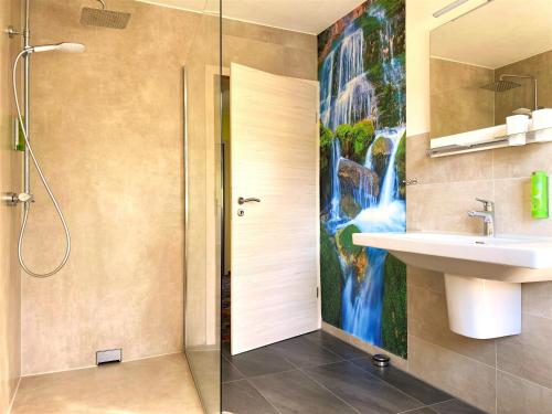 a bathroom with a shower and a sink at Berghotel Talblick in Holzhau
