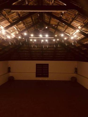 a room with a bunch of lights on the ceiling at Neermathalam, a traditional kerala tharavadu in Palakkad