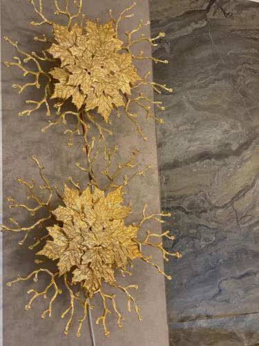 a painting of a gold leafed tree on the ground at Superbe appartement de luxe- proche de la mer - Dahomey city - Bouznika in Bouznika