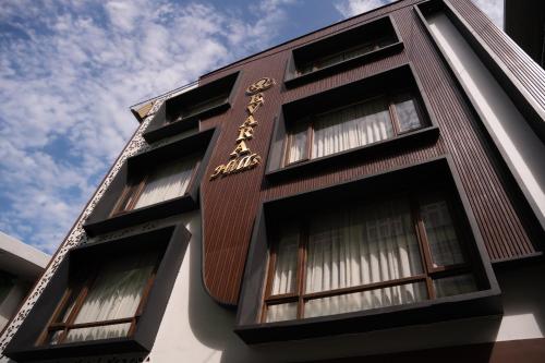 a building with a sign on the side of it at Evara Hills, Gangtok in Gangtok