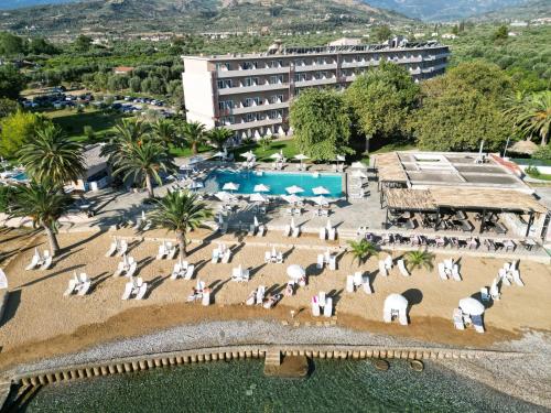 an aerial view of a resort with chairs and a pool at Long Beach Hotel & Resort in Lóngos