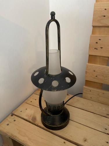 a black and white lamp sitting on a wooden table at Yairbrig Holiday in Galashiels