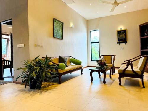 a living room with a couch and a table at Rivorich Residence Kandy in Kandy