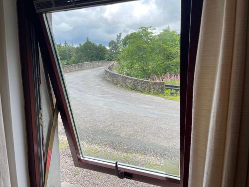 a view of a road from a window of a train at Yairbrig Holiday in Galashiels