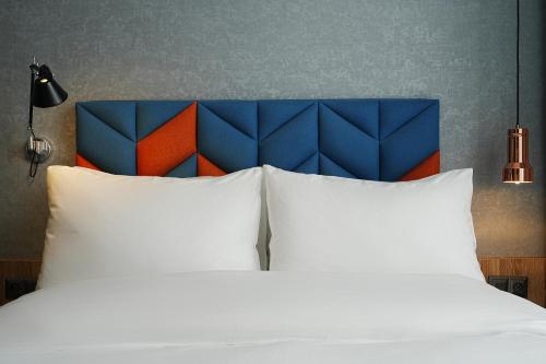 Postel nebo postele na pokoji v ubytování Hotel Faros Gdansk Airport