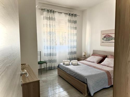 Posteľ alebo postele v izbe v ubytovaní Casa Gio - Appartamenti Vacanze