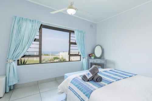 Postel nebo postele na pokoji v ubytování Fifty on the Rocks