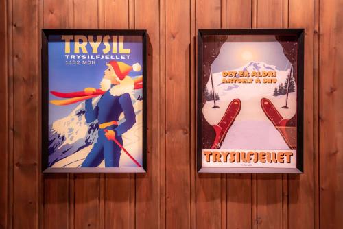 a pair of posters on a wall with ski signs at Trysilfjellet Nord 170 in Trysil