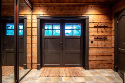 an entrance to a house with two doors at Trysilfjellet Nord 170 in Trysil
