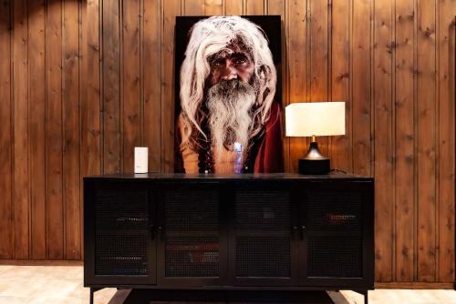 a painting of a man with a beard on a wall at Trysilfjellet Nord 170 in Trysil