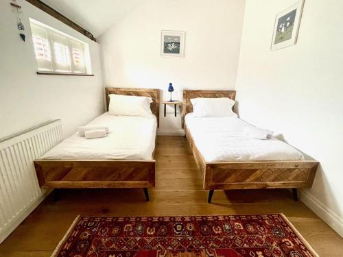 Voodi või voodid majutusasutuse Stable Cottage at Lee Wick Farm Cottages & Glamping toas