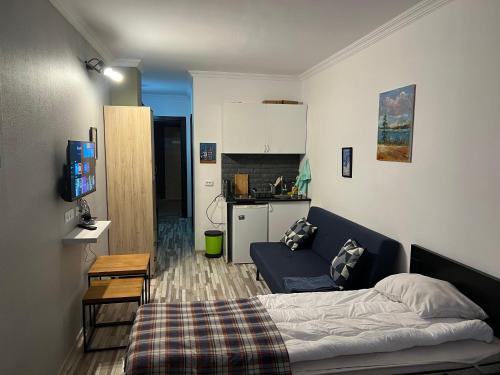 Postel nebo postele na pokoji v ubytování Gudauri loft Apartment 509