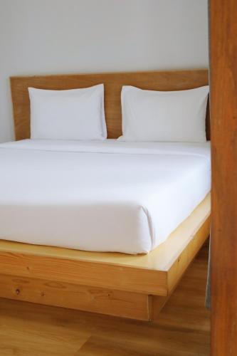 Postel nebo postele na pokoji v ubytování Intha Resort