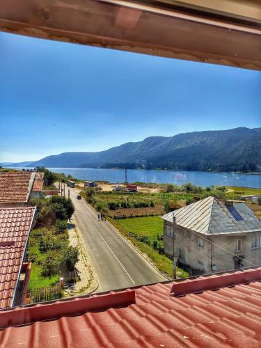 a view from the roof of a house with a road and a lake at Ardo Spa Hotel and Restaurant in Sarnitsa