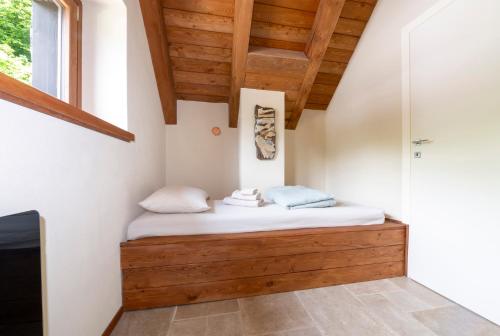 Letto o letti in una camera di Baita Croh - Villaggio dei Crodini