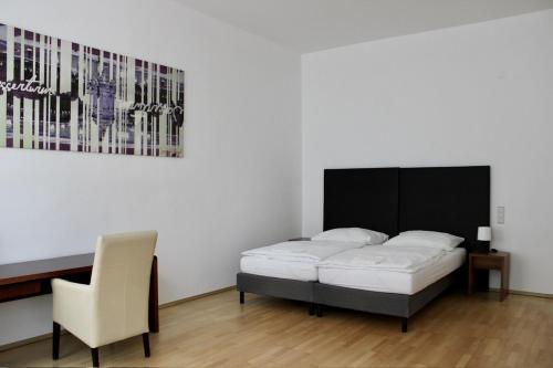 Cama o camas de una habitación en City Inn 24H Self Check-In by H&H Hotels