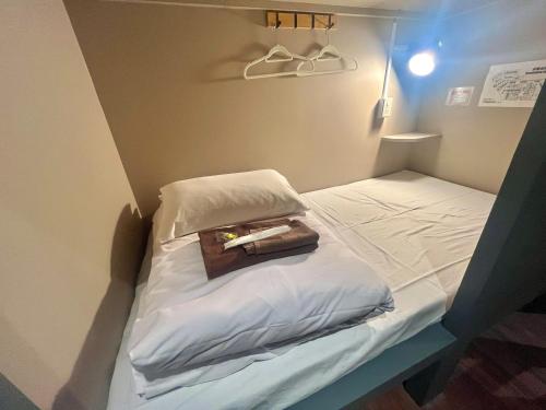 Postel nebo postele na pokoji v ubytování 新宿ニッカホテル