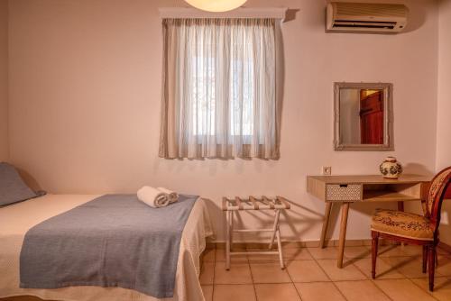 Ένα ή περισσότερα κρεβάτια σε δωμάτιο στο Villa Christini