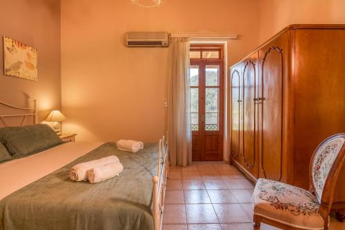 Ένα ή περισσότερα κρεβάτια σε δωμάτιο στο Villa Christini