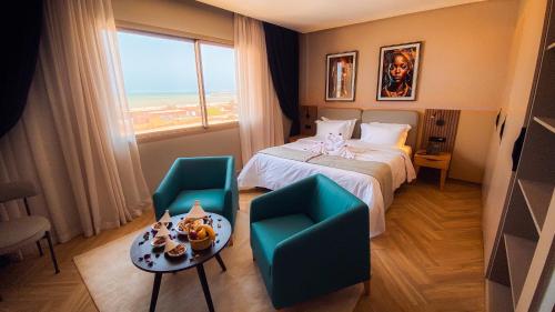 Postel nebo postele na pokoji v ubytování Elite View Hotel Dakhla