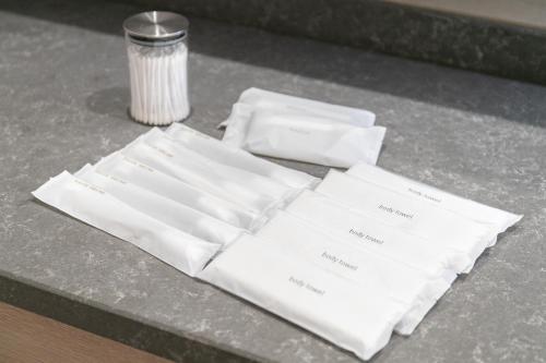 a pile of white napkins sitting on a table at Mova Villa Ozu in Ozu