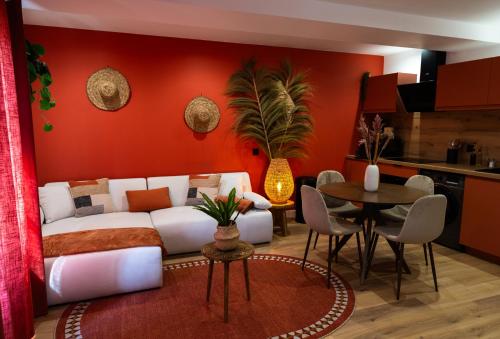 a living room with a white couch and a table at La Casa, Suite mexicaine d'exception à Saumur in Saumur