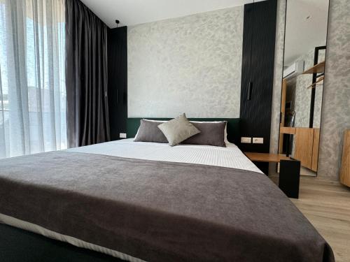Ένα ή περισσότερα κρεβάτια σε δωμάτιο στο Twins Hotel Vlore