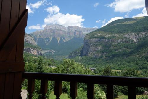 a view of the mountains from a balcony at Hotel Abetos in Torla