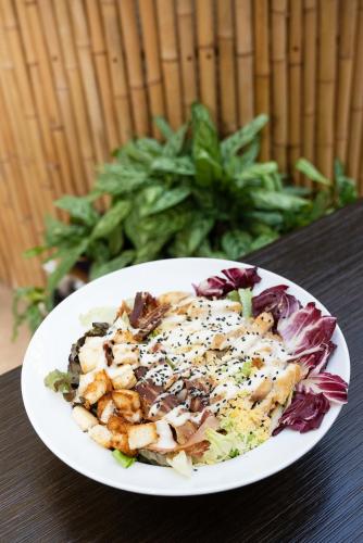a white plate of food on a table at Blank Hotel Recoleta in Buenos Aires