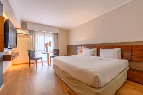Ένα ή περισσότερα κρεβάτια σε δωμάτιο στο Exe Hotel Cataratas