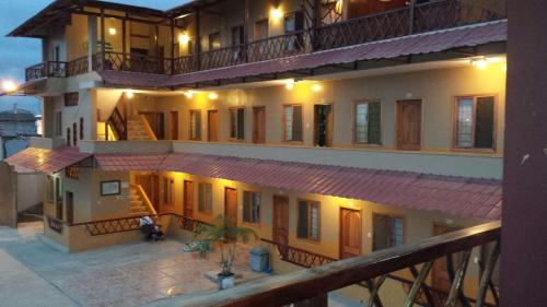 an image of a building with lights on at Hotel Mediterraneo in Canoa