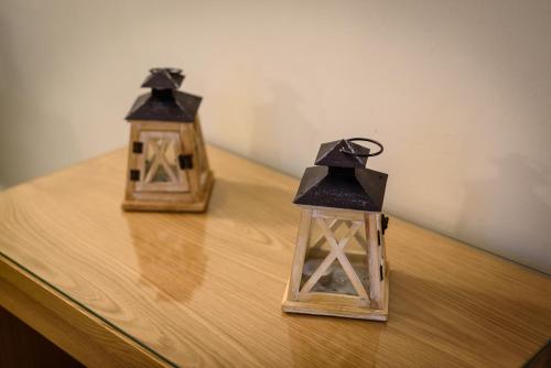 two nesting boxes sitting on top of a wooden table at Ionion Beach Apartment Hotel & Spa in Arkoudi