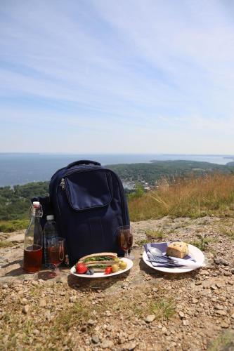 a table with food and drinks on top of a hill at Hartstone Inn in Camden