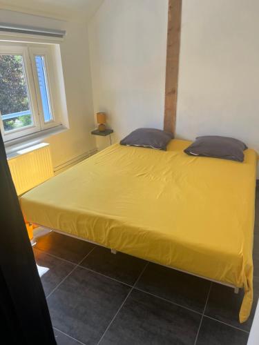 Postel nebo postele na pokoji v ubytování L'Entracte