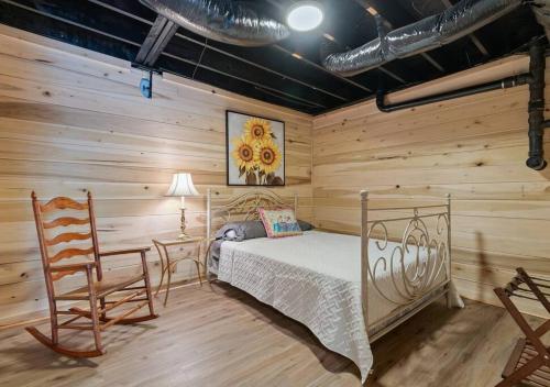 a bedroom with a bed and a wooden wall at Reflection Bay in Winchester