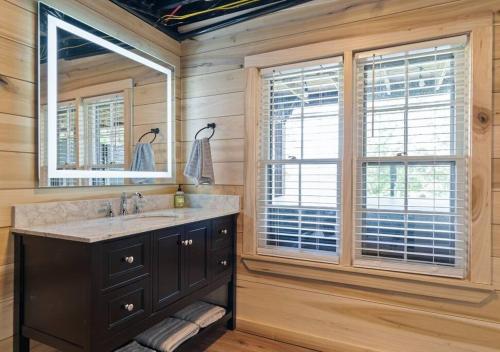 a bathroom with a sink and a mirror at Reflection Bay in Winchester