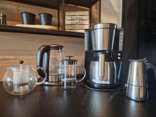 a group of appliances sitting on top of a counter at Alpenchalet Vils Tirol in Vils
