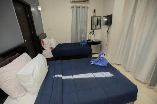 Letto o letti in una camera di Horus Guest House Pyramids