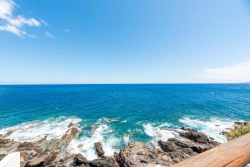 a view of the ocean from a balcony at Luminous loft apartment next to the Atlantic Ocean in Radazul