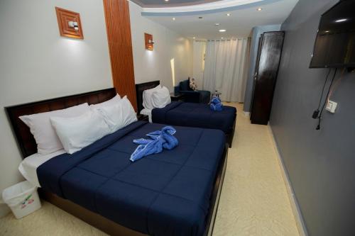 Letto o letti in una camera di Horus Guest House Pyramids