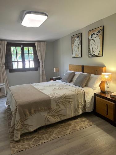 Postel nebo postele na pokoji v ubytování Chalet playa Rianxo