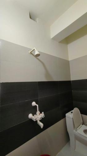 a bathroom with a sink and a toilet at Sunrise Homestay Agra Near Taj Mahal in Agra