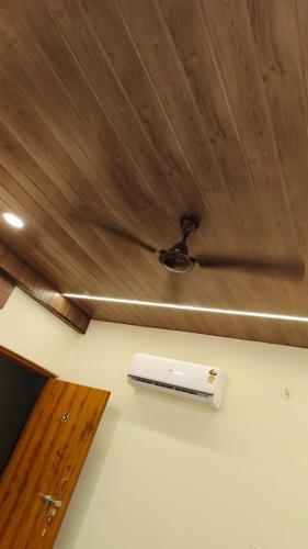 a ceiling with a white heater on a room at Sunrise Homestay Agra Near Taj Mahal in Agra