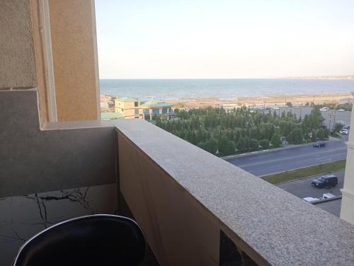 a view of the ocean from the balcony of a building at У Эльмана in Sumqayyt