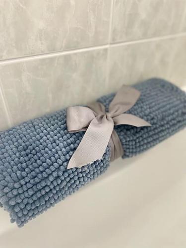 a blue scarf with a bow on a wall at Mountainview Cottage in Dungiven