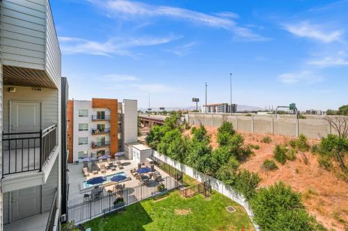 an apartment balcony with a patio and a yard at Serene Space with Easy City Access in Salt Lake City