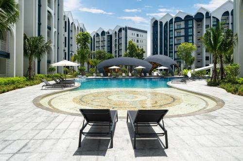 a swimming pool in the middle of a building at The Halo 1 Naiyang Beach in Nai Yang Beach